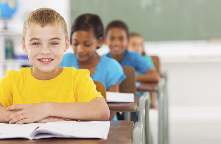 Young boy in class with good habits