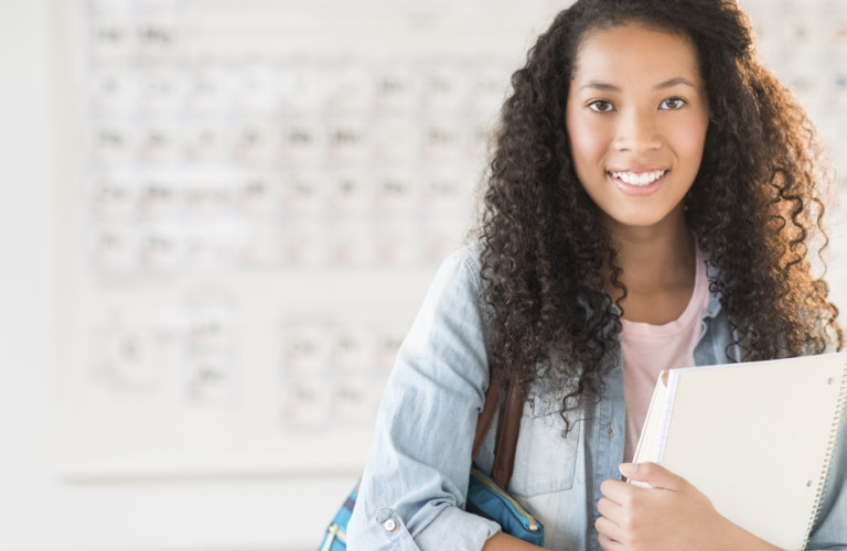 Young teenager ready for school with a plan