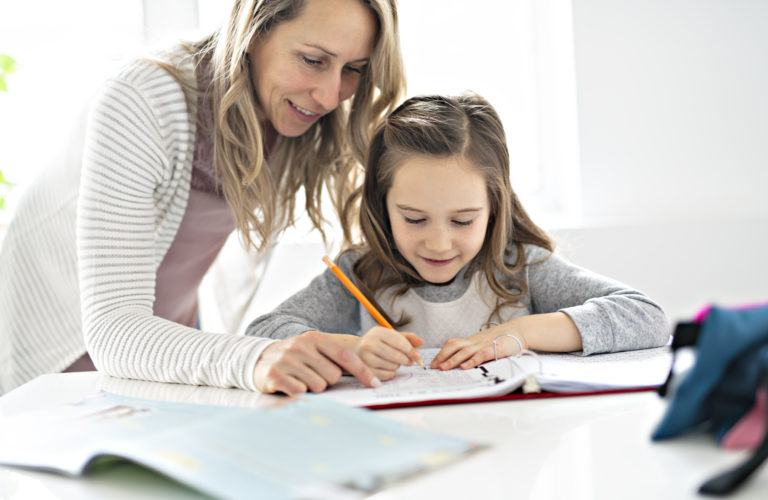 A Mother and Child doing homework at home