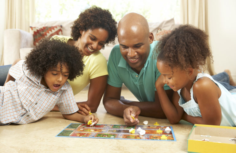 Family Plays Board Game