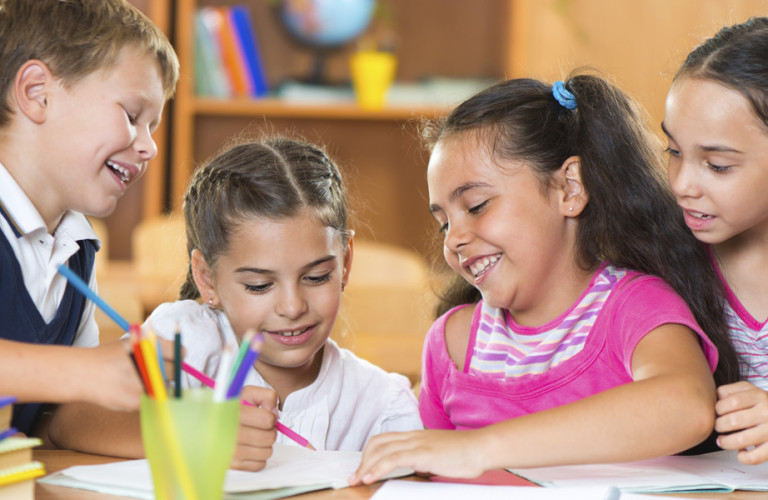 small children reading together in class