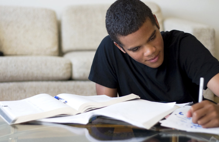 Young man studying in the living room